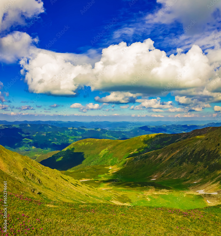 Panorama of mountain ridges with clouds and fog in the morning evening time, at sunrise, sunset Panorama of mountain ridges with clouds and fog in the morning evening time, at sunrise, sunset