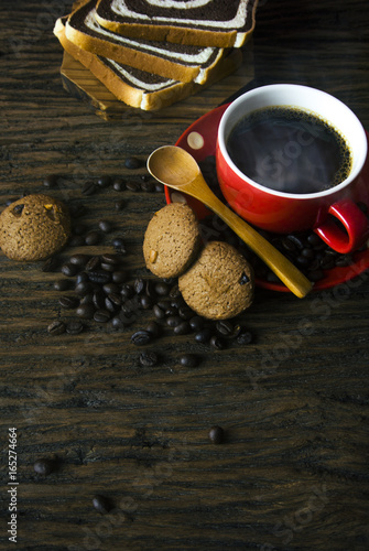 hot coffee with cookies and bread with wood ground