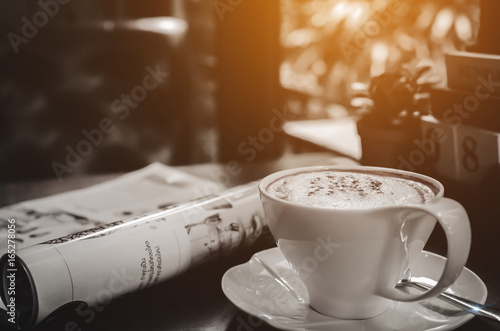 Hot coffee for morning work or a holiday in a cafe with a refreshing garden. Picture for card or poster