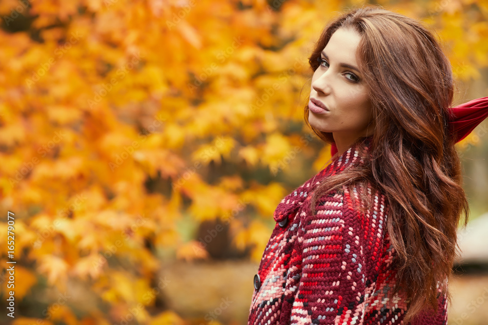 season and people concept - beautiful happy young woman walking in autumn park season and people concept - beautiful happy young woman walking in autumn park