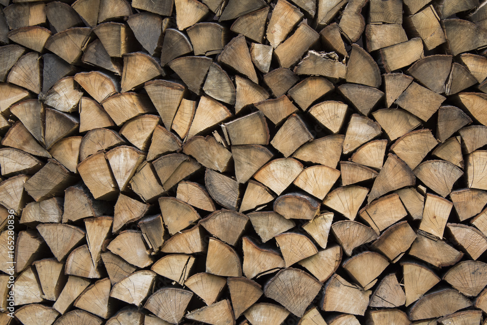 Firewood ready for winter. Wooden background Firewood ready for winter. Wooden background