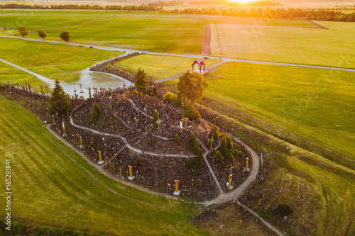 Drone aerial view of Hill of Crosses (KRYZIU KALNAS). It is a famous religious site of catholic pilgrimage in Lithuania