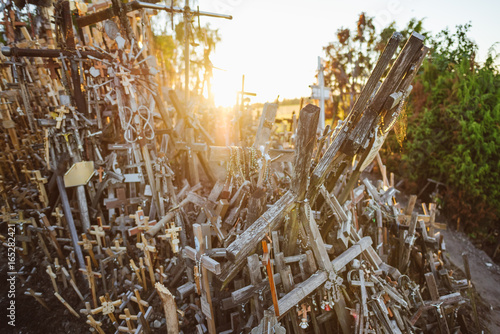 Hill of crosses (Kryziu kalnas), pilgrimage site in northern Lithuania, summer sunset time photo