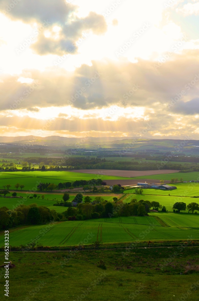 sun ray over scotland landscape