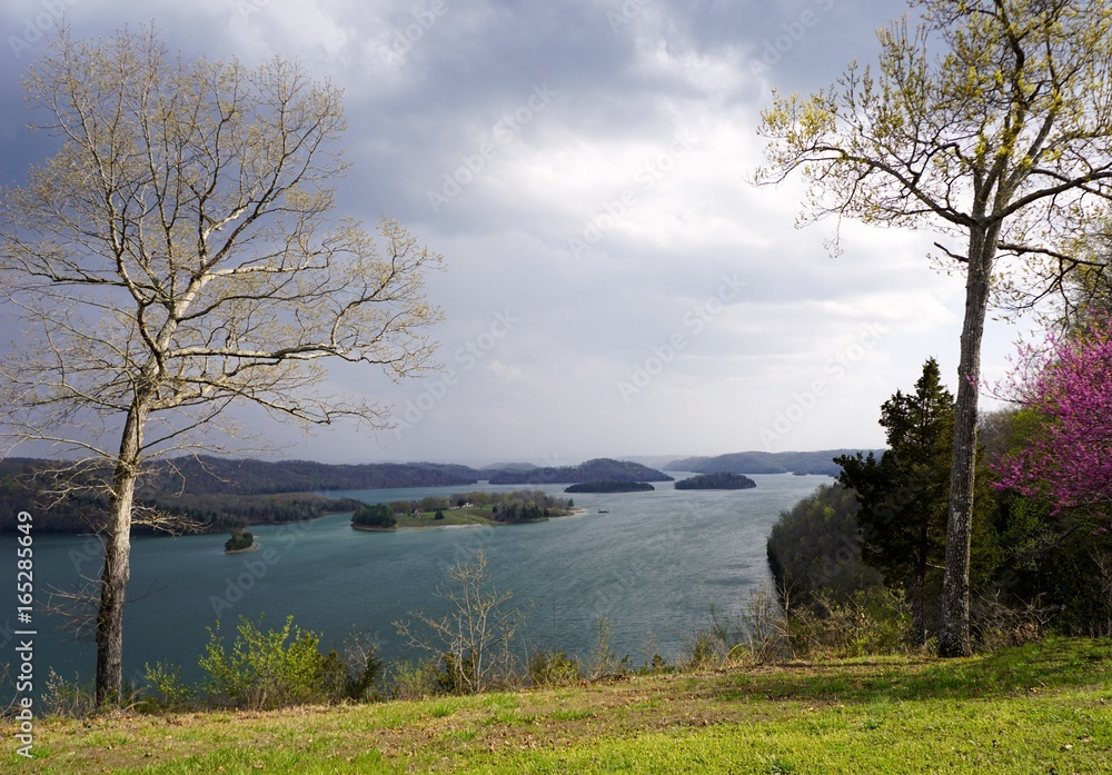 Lakefront Park Islands Dale Hollow State Resort fall evening before storm in Kentucky and Tennessee border lodge patio Overlook of Mountain lake trees with very colorful foreground and background Lakefront Park Islands Dale Hollow State Resort fall evening before storm in Kentucky and Tennessee border lodge patio Overlook of Mountain lake trees with very colorful foreground and background
