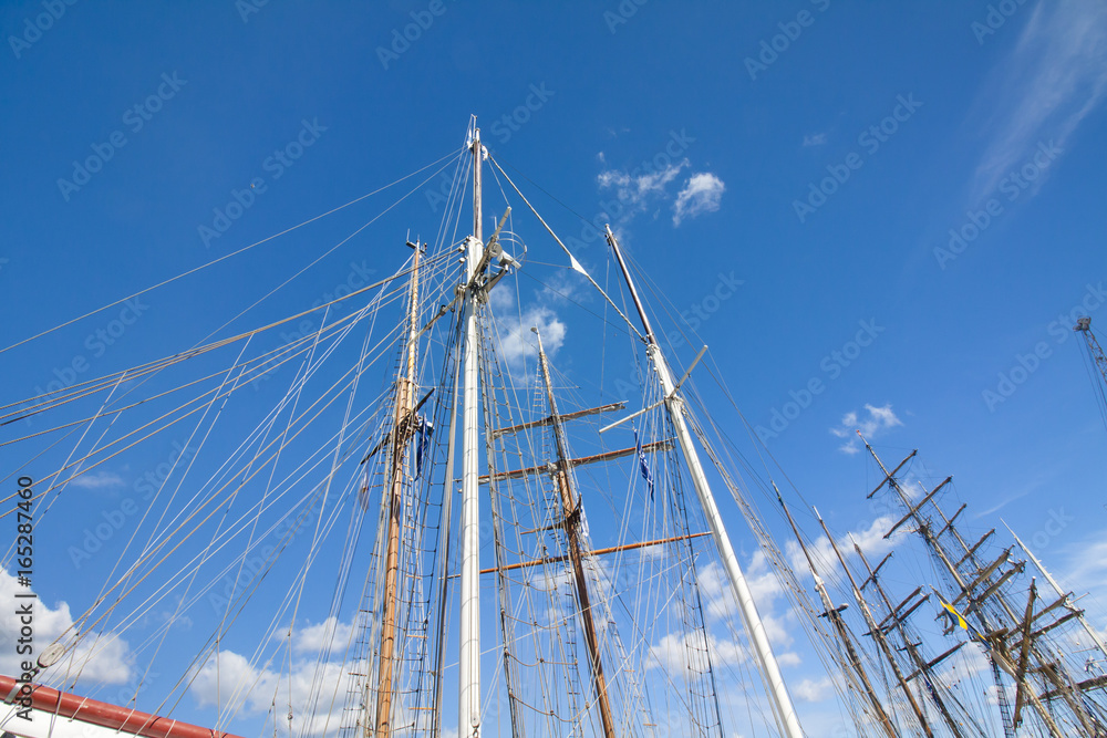 Masts of sailboat at the blue sky background. THE TALL SHIPS RACES KOTKA 2017. Kotka, Finland 16.07.2017. Masts of sailboat at the blue sky background. THE TALL SHIPS RACES KOTKA 2017. Kotka, Finland 16.07.2017.