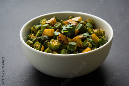 Indian masala fried bhindi or bhendi or Okra or ladyfinger curry or sabji, selective focus photo