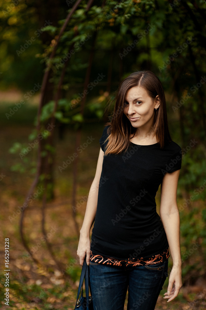 Beautiful brunette girl on a walk outdoors Beautiful brunette girl on a walk outdoors