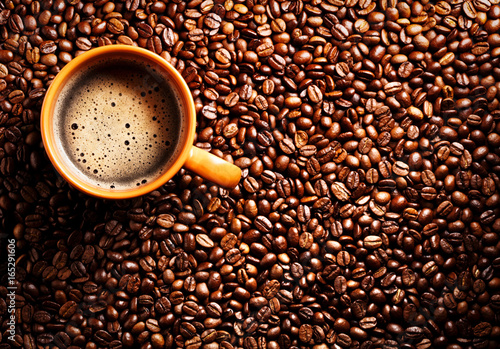 coffee cup on coffee beans background