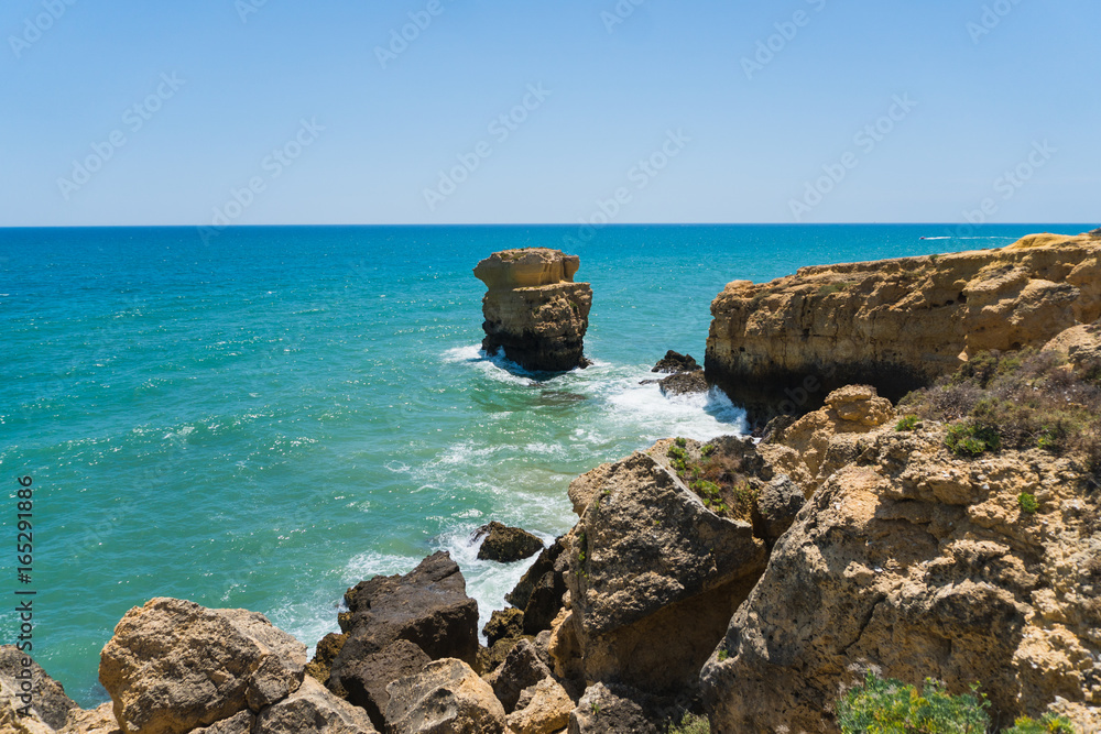 A view of a marvelous sandy beach portugal. Summer time A view of a marvelous sandy beach portugal. Summer time