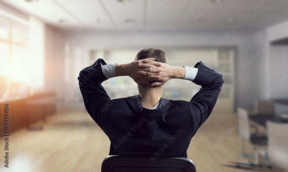 Businessman in chair having rest Businessman in chair having rest