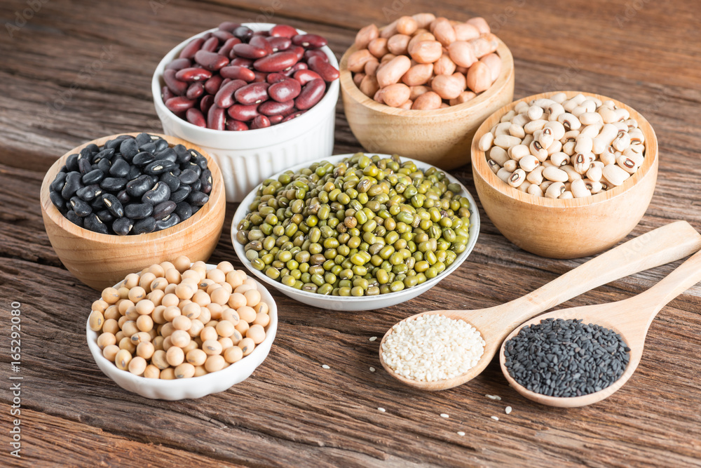 Mixed beans and sesame on wood background. Mixed beans and sesame on wood background.