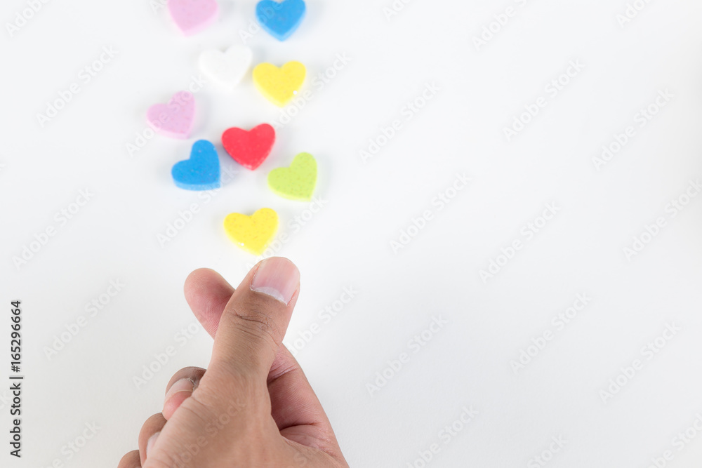Colorful hearts sending out from hand on white background, love concept Colorful hearts sending out from hand on white background, love concept