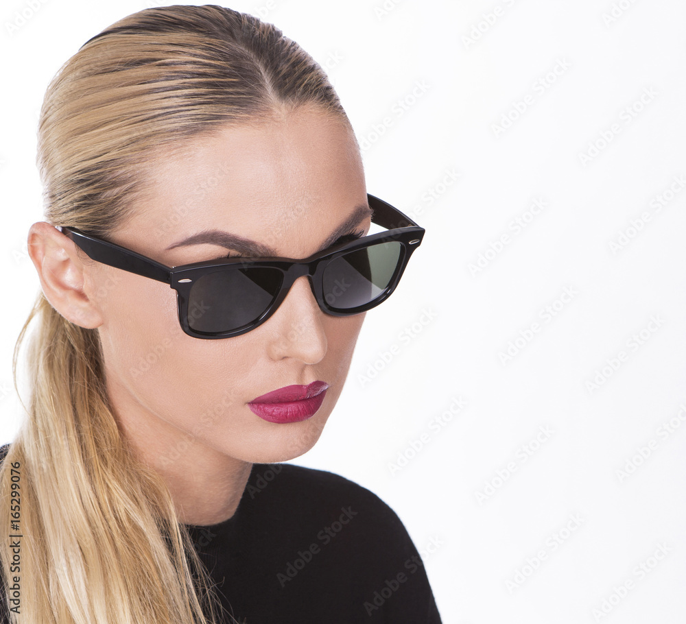 Portrait of a girl wearing fashionable sunglasses Portrait of a girl wearing fashionable sunglasses