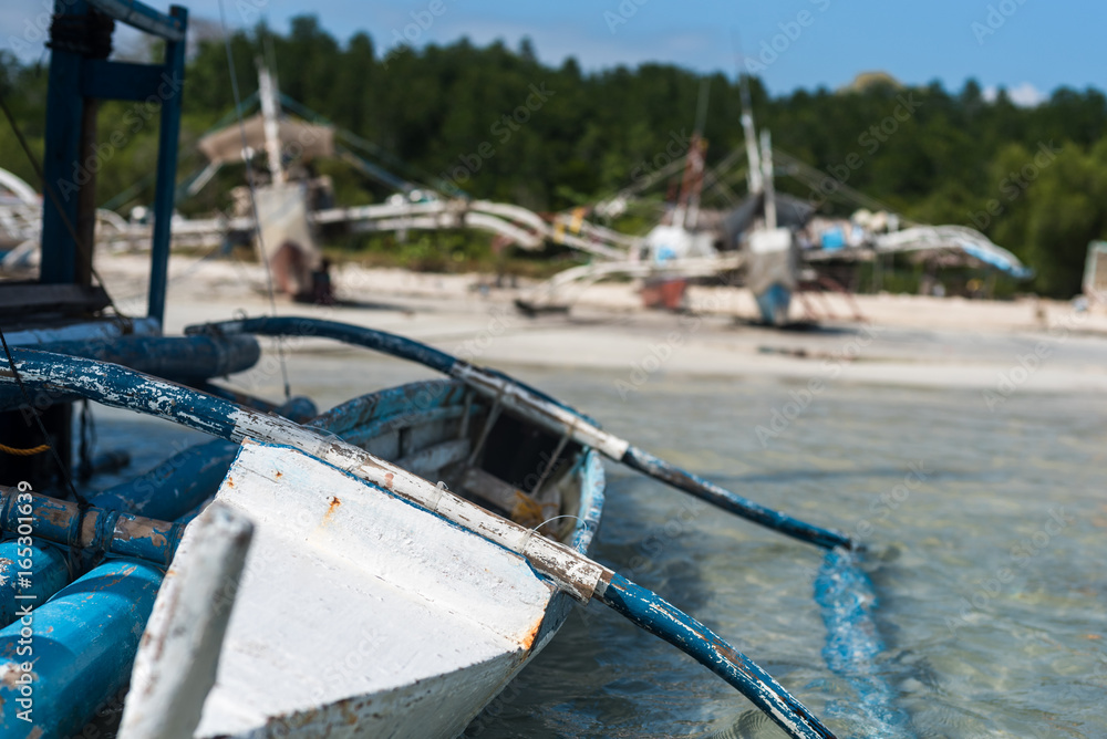 A keeling local fisherman's boat in turquoise water