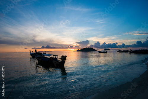 Beautiful sunset and Thai boats