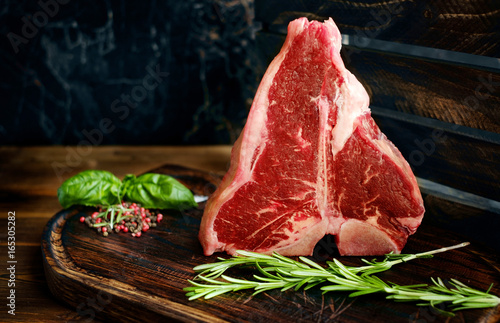 Tablou pe pânză raw porterhouse steak with herbs