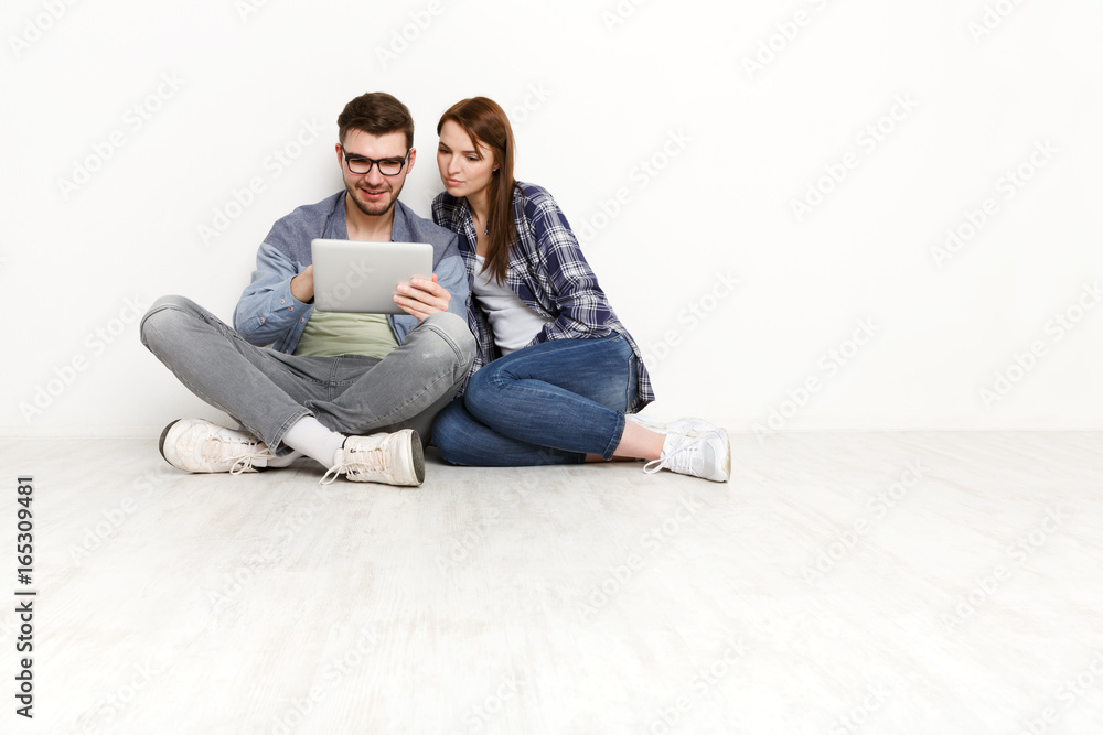 Couple ordering purchase with digital tablet Couple ordering purchase with digital tablet