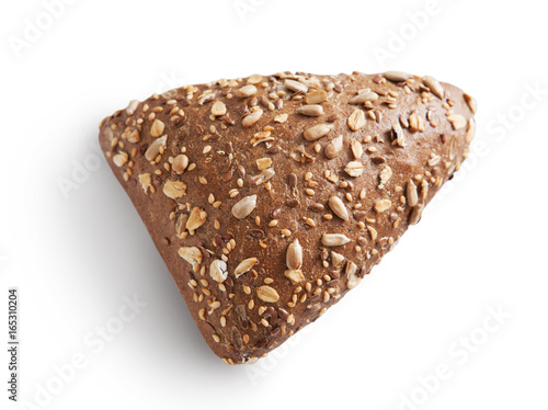 Rye triangle bun with seeds at white background