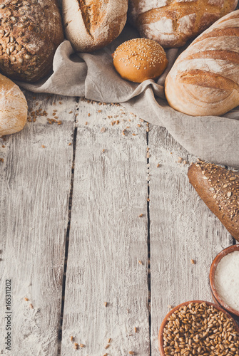 Bread background on rustic wood