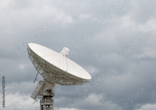 Radio telescope dish pointing at the sky