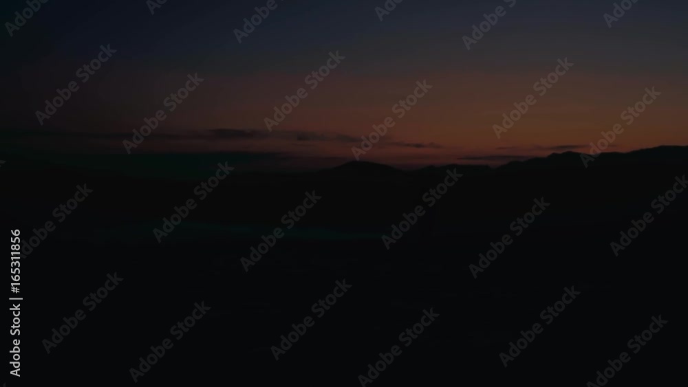 man hiking on the mountain at sunset with the horizon in the background
man hiking on the mountain at sunset with the horizon in the background