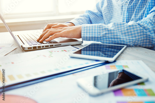 Young businessman working in the office.