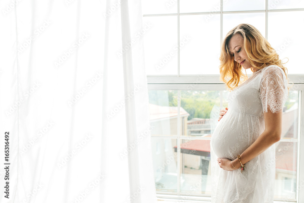 Beautiful adult pregnant woman. Waiting for the baby. Pregnancy. Care, tenderness, motherhood, childbirth. Beautiful adult pregnant woman. Waiting for the baby. Pregnancy. Care, tenderness, motherhood, childbirth.