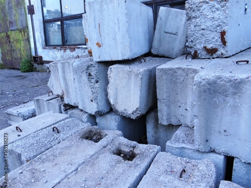 Concrete blocks , stacked on top of each other.