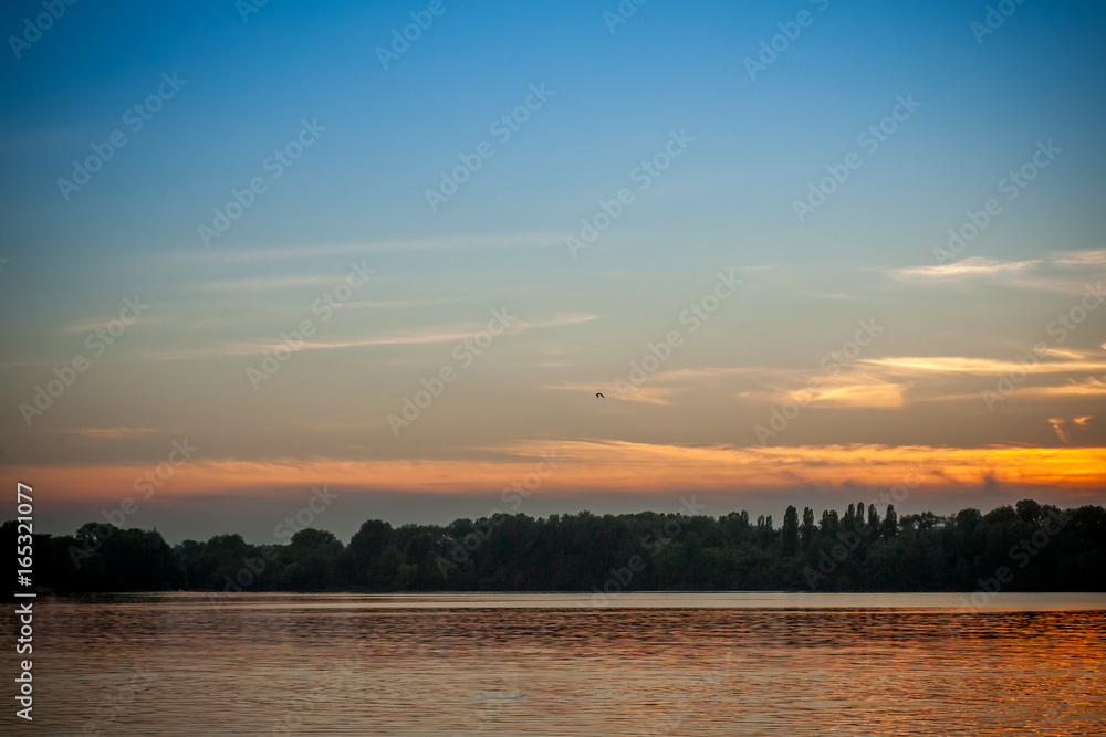 beautiful majestic sunset on the background of the river bank with no people in Dnipro Kiev Ukraine