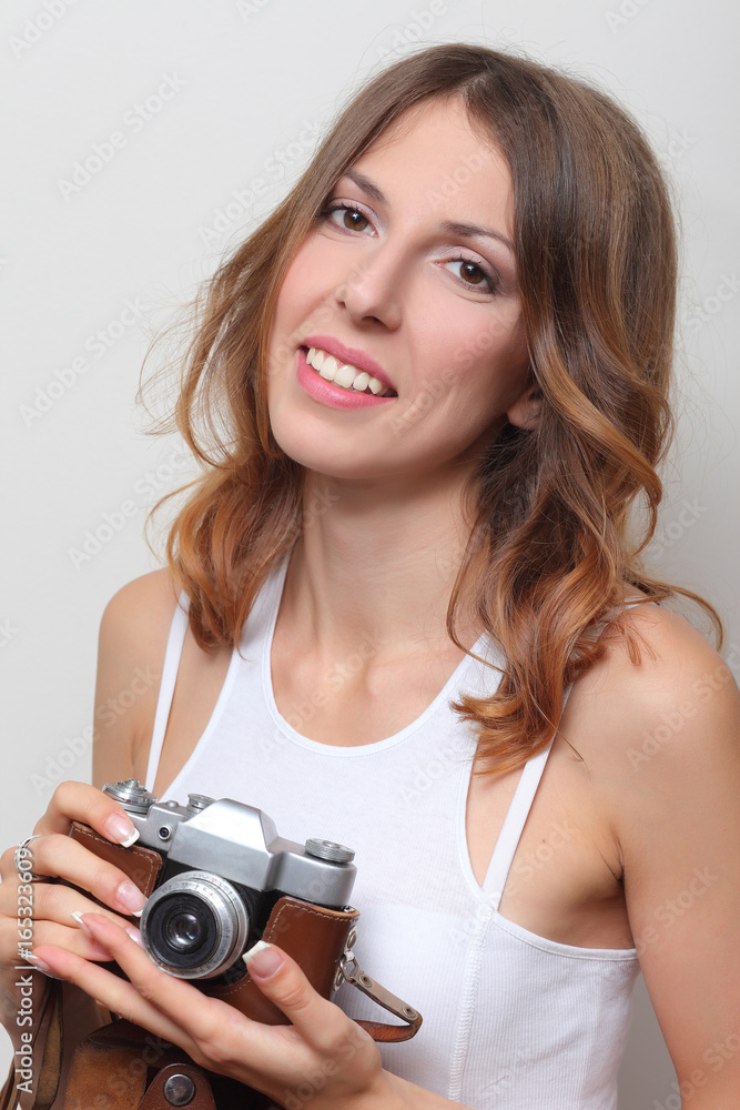 Fototapeta premium photographer holding a film camera in hands