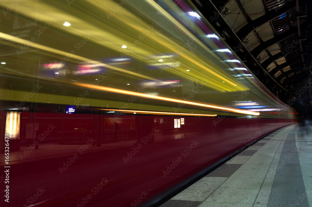 Train is rapidly passing the platform in Berlin Germany ling exposure motion blur