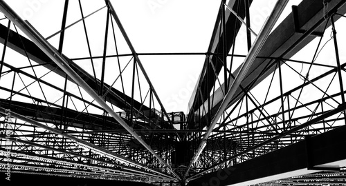 Large metal structure of the ferris wheel in b&w
