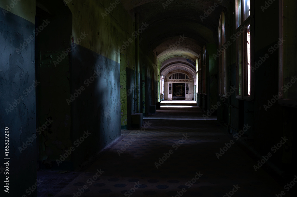 Dark corridor of the abandoned tuberculosis hospital in Germany  - obrazy, fototapety, plakaty 
