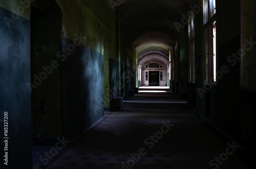 Fototapeta Naklejka Na Ścianę i Meble -  Dark corridor of the abandoned tuberculosis hospital in Germany 
