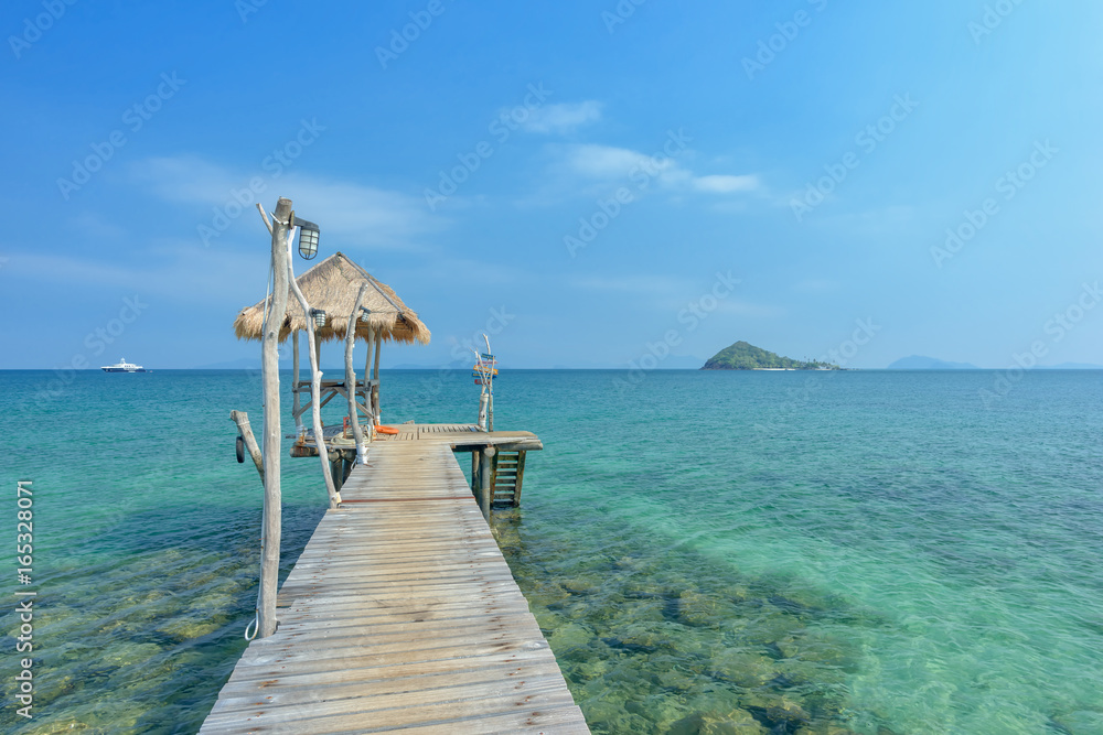 Long wooden bridge go to pavilion on the sea in beautiful tropical island, Thailand Long wooden bridge go to pavilion on the sea in beautiful tropical island, Thailand