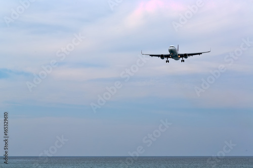 Fototapeta Naklejka Na Ścianę i Meble -  Passenger liner over the beach and the sea