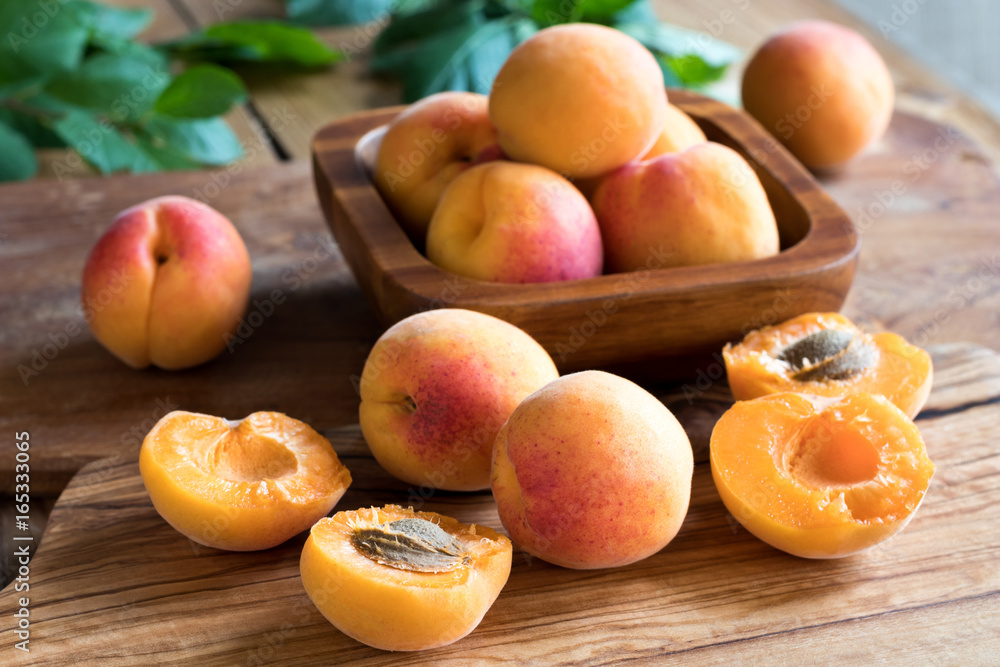 Freshly harvested apricots on a wooden table
