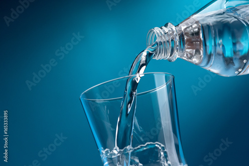 Pouring fresh water into a glass