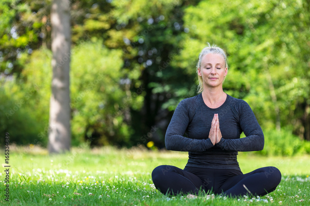 Mature Middle Aged Fit Healthy Woman Practicing Yoga Outside