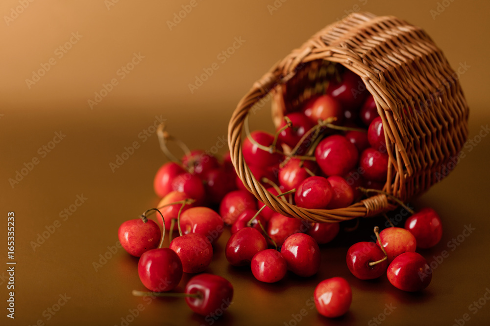 Cherries in a basket on a gold background. Cherries in a basket on a gold background.