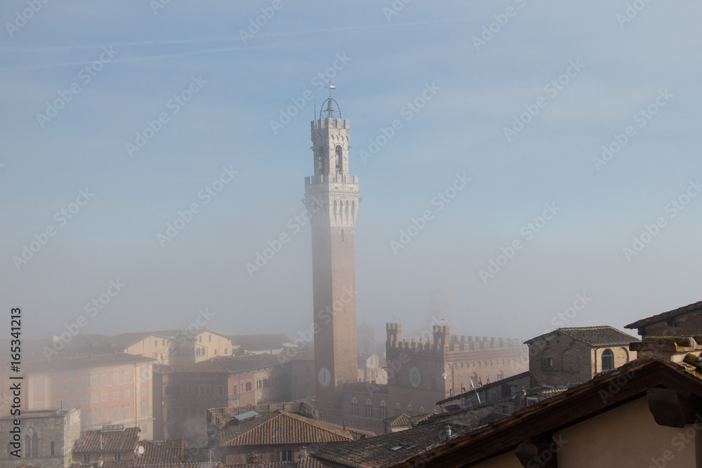 Torre del Mangia in fog. Tuscany. Italy.