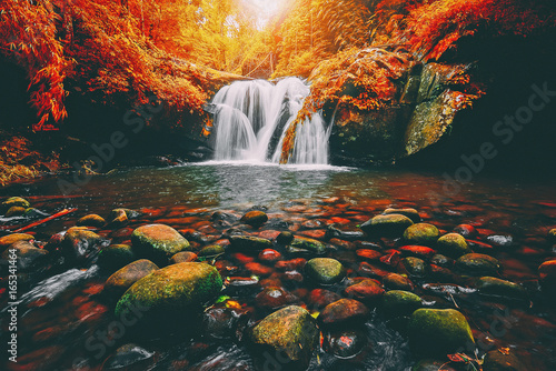 Landscape photo, Phu Soi Dao Waterfall with yellow leaves trees, © Goodvibes Photo