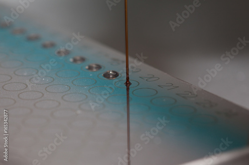 Pipetting of MALDI-TOF target in laboratory, mass-spectrometry