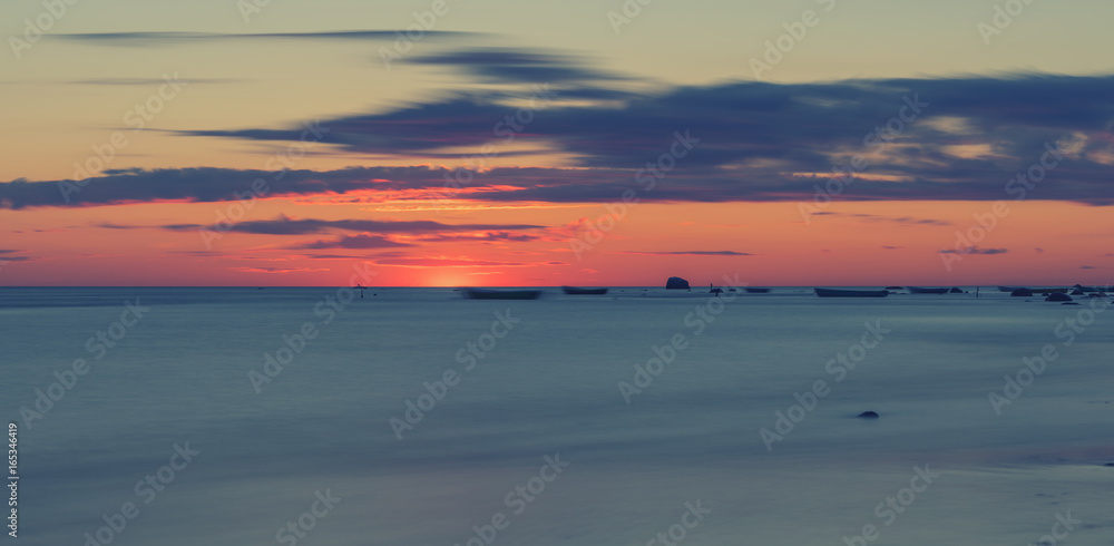 long exposure landscape image of sea during  sunset