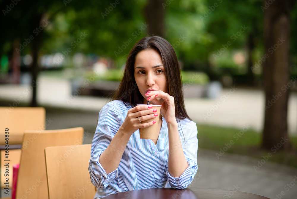Beautiful girl smiling and drinking coffee. Beautiful girl smiling and drinking coffee.