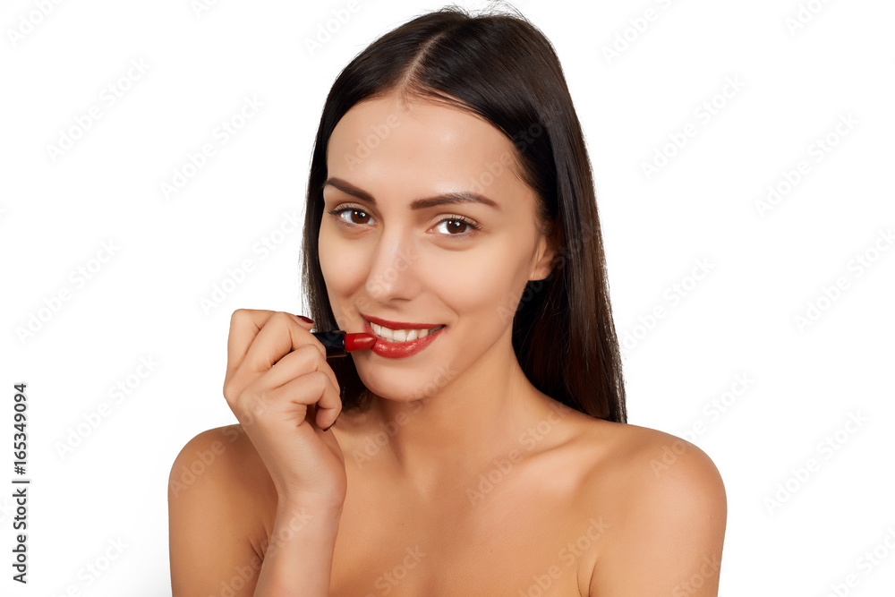 Woman applying lipstick Woman applying lipstick