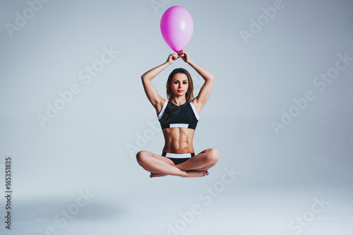Woman balloon levitation
