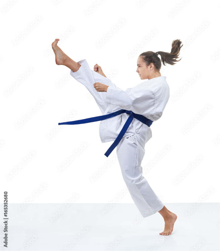 High kick with a foot is beaten by an adult girl High kick with a foot is beaten by an adult girl