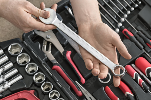 Open toolbox and male hands